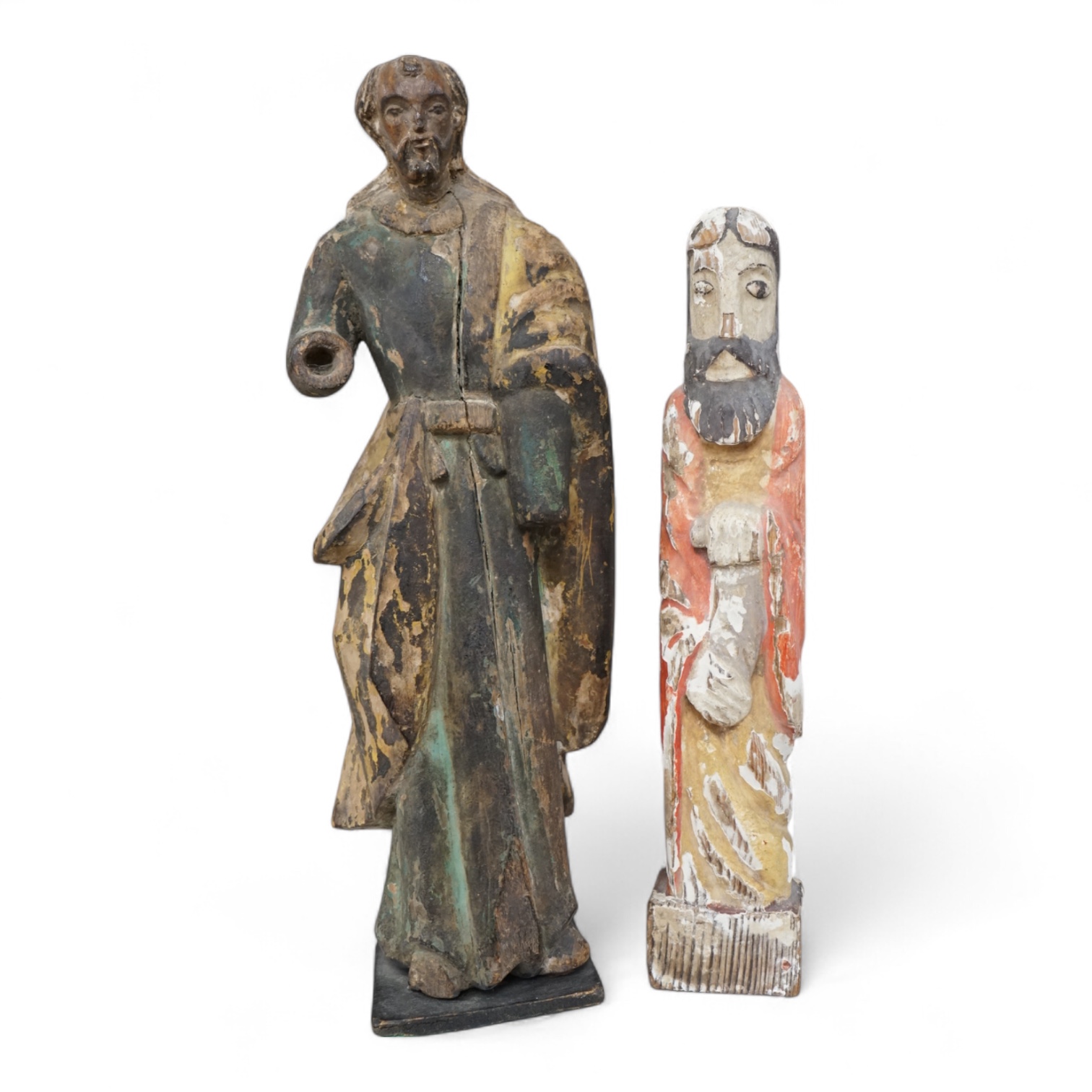 An antique carved wood figure of a Saint, traces of old paint and another figure, largest 36cm high (2)